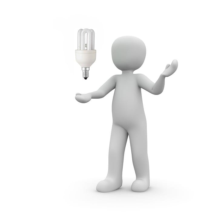 Electrician figure holding a light bulb